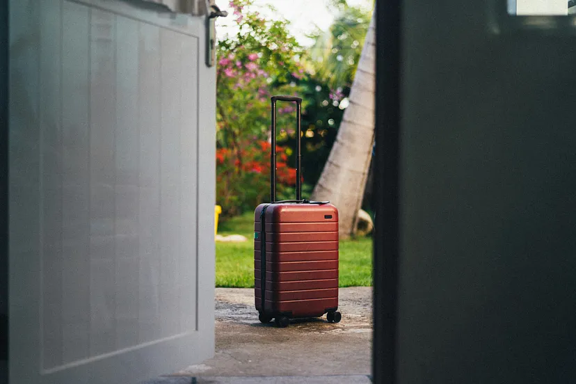 The suitcase outside the door represents the work stress we think we can leave outside the home, but we cannot